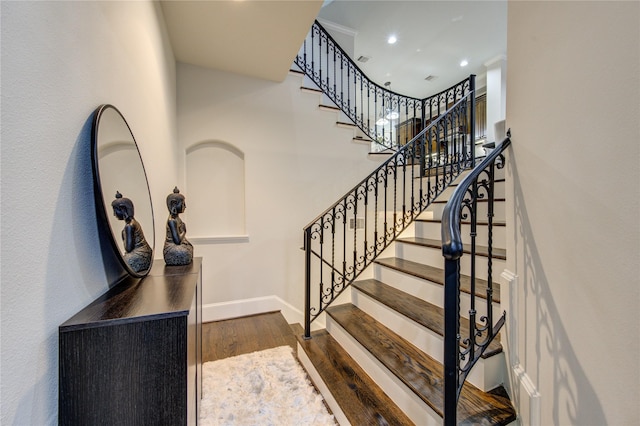 5531 Pine St Unit H, Houston, TX 77081 - stairs with wood finished floors, a high ceiling, and recessed lighting