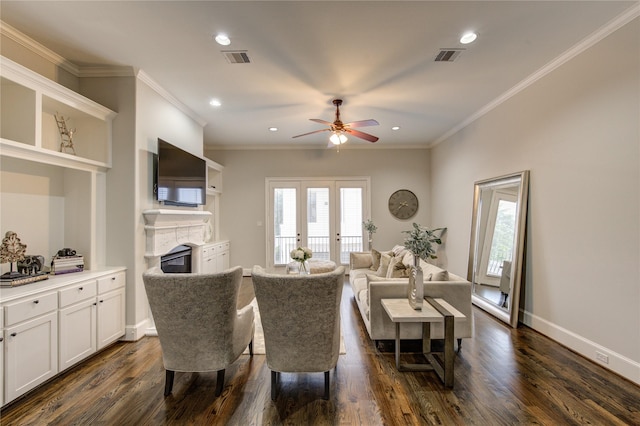 5531 Pine St Unit H, Houston, TX 77081 - living area with a glass covered fireplace, dark wood finished floors, ceiling fan, ornamental molding, and recessed lighting