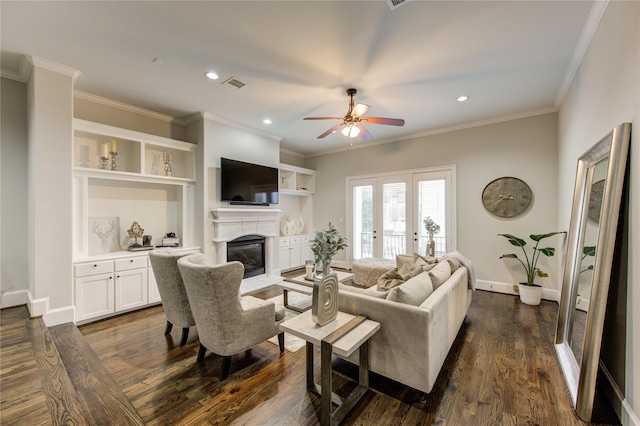5531 Pine St Unit H, Houston, TX 77081 - living room featuring a glass covered fireplace, ceiling fan, crown molding, recessed lighting, and dark wood-style floors