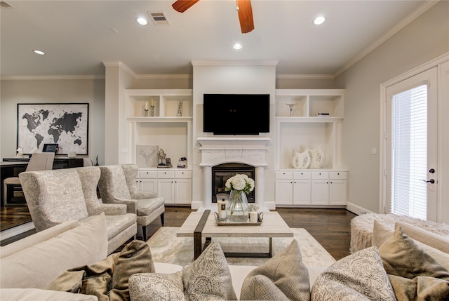 5531 Pine St Unit H, Houston, TX 77081 - living room with ceiling fan, dark wood-style floors, a glass covered fireplace, ornamental molding, and recessed lighting