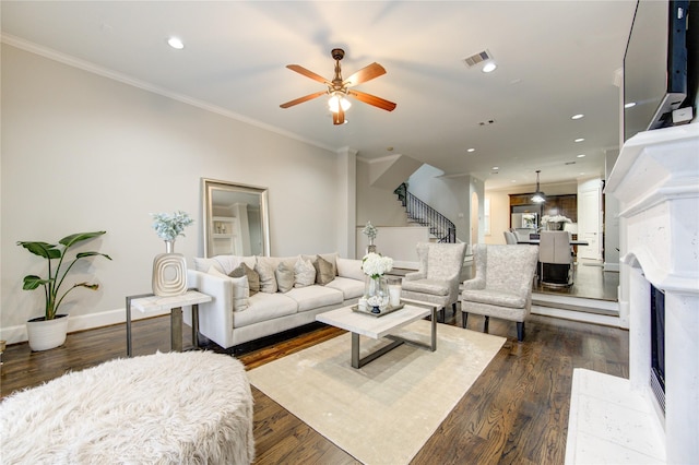 5531 Pine St Unit H, Houston, TX 77081 - living room with stairway, a ceiling fan, dark wood-type flooring, recessed lighting, and crown molding