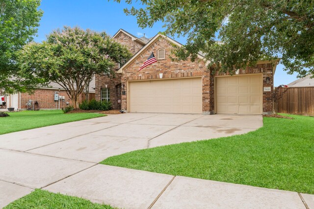31820 Forest Oak Ln, Conroe, TX 77385 - traditional-style house with concrete driveway, a garage, and brick siding