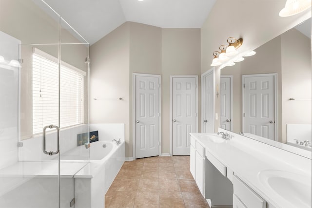 31820 Forest Oak Ln, Conroe, TX 77385 - full bathroom with a bath, double vanity, vaulted ceiling, and a shower stall