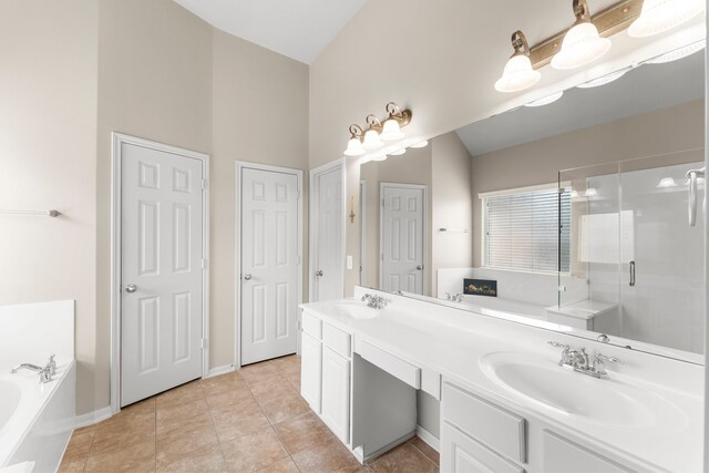 31820 Forest Oak Ln, Conroe, TX 77385 - full bath featuring a bath, double vanity, a stall shower, and tile patterned flooring