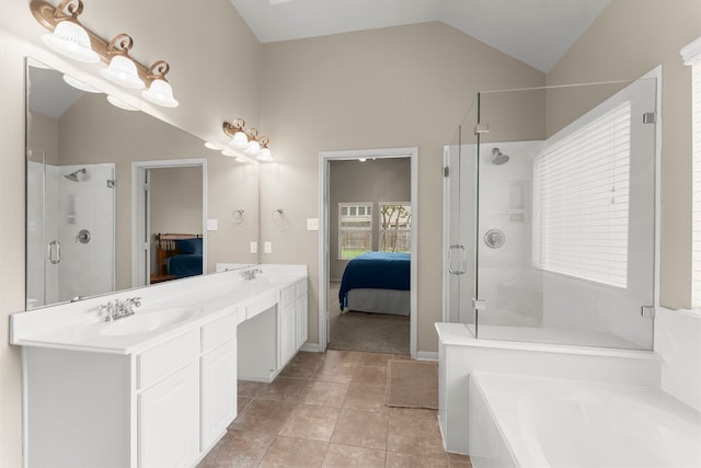 31820 Forest Oak Ln, Conroe, TX 77385 - full bathroom with ensuite bathroom, a shower stall, vaulted ceiling, double vanity, and tile patterned flooring