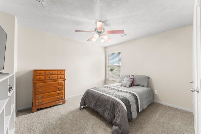 31820 Forest Oak Ln, Conroe, TX 77385 - bedroom with carpet flooring, a textured ceiling, and a ceiling fan