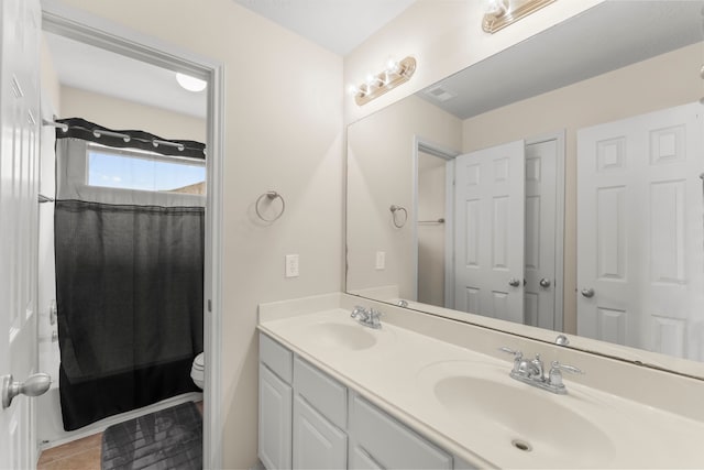 31820 Forest Oak Ln, Conroe, TX 77385 - bathroom featuring double vanity, tile patterned flooring, and shower / bath combo