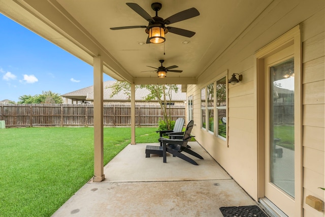 31820 Forest Oak Ln, Conroe, TX 77385 - fenced backyard with a ceiling fan and a patio
