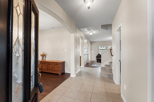 31820 Forest Oak Ln, Conroe, TX 77385 - foyer entrance with arched walkways, tile patterned floors, and stairs