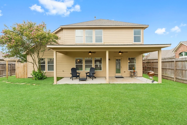 31820 Forest Oak Ln, Conroe, TX 77385 - back of property with ceiling fan, a fenced backyard, and a patio area