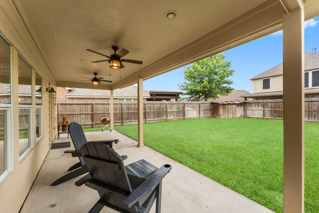 31820 Forest Oak Ln, Conroe, TX 77385 - fenced backyard featuring a patio area and a ceiling fan