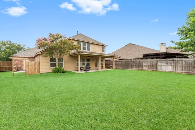 31820 Forest Oak Ln, Conroe, TX 77385 - rear view of house with a fenced backyard, a patio area, and roof with shingles