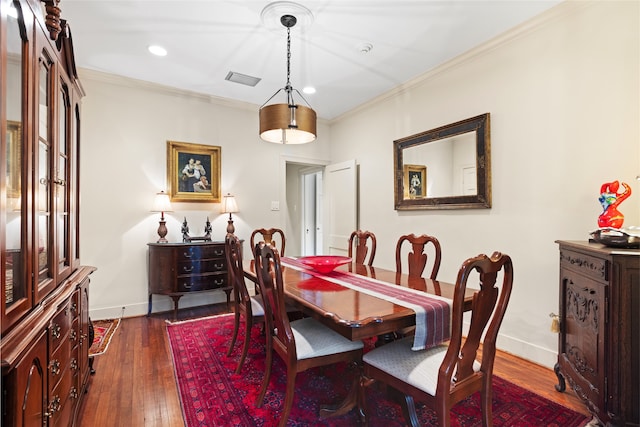 1311 Peden St, Houston, TX 77006 - dining area with dark wood-style flooring, ornamental molding, and recessed lighting