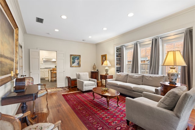1311 Peden St, Houston, TX 77006 - living room with recessed lighting, dark wood-style floors, and crown molding