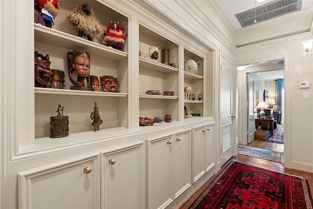 1311 Peden St, Houston, TX 77006 - hall featuring crown molding and dark wood-type flooring