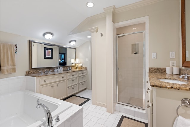 1311 Peden St, Houston, TX 77006 - bathroom featuring a shower stall, a bath, vanity, tile patterned flooring, and recessed lighting