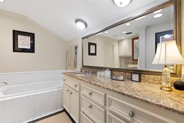 1311 Peden St, Houston, TX 77006 - bathroom featuring vanity, a garden tub, tile patterned flooring, lofted ceiling, and recessed lighting