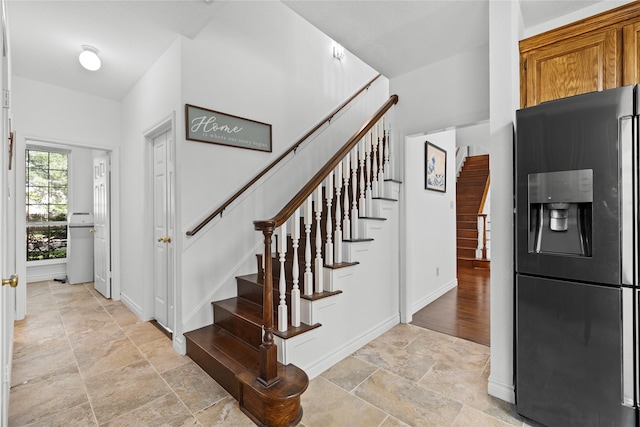 1711 Alcorn Bayou Dr, Sugar Land, TX 77479 - stairway with stone finish flooring and baseboards