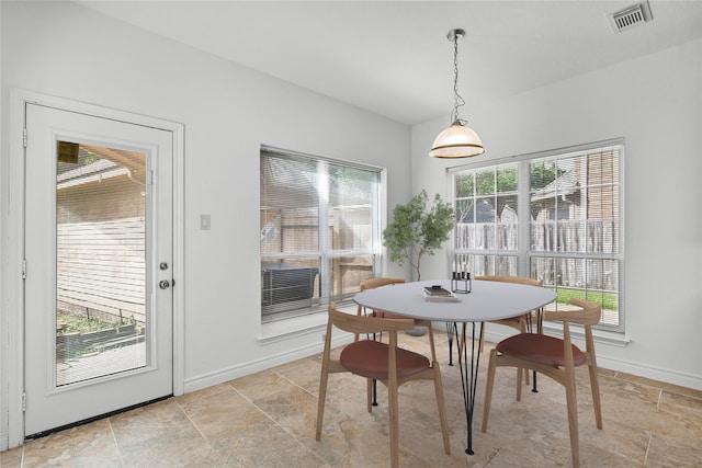 1711 Alcorn Bayou Dr, Sugar Land, TX 77479 - dining area with light stone finish floors