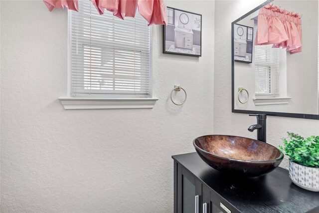 1711 Alcorn Bayou Dr, Sugar Land, TX 77479 - bathroom featuring a textured wall and vanity