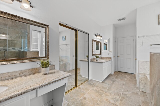 1711 Alcorn Bayou Dr, Sugar Land, TX 77479 - full bath with two vanities, a stall shower, and stone finish flooring
