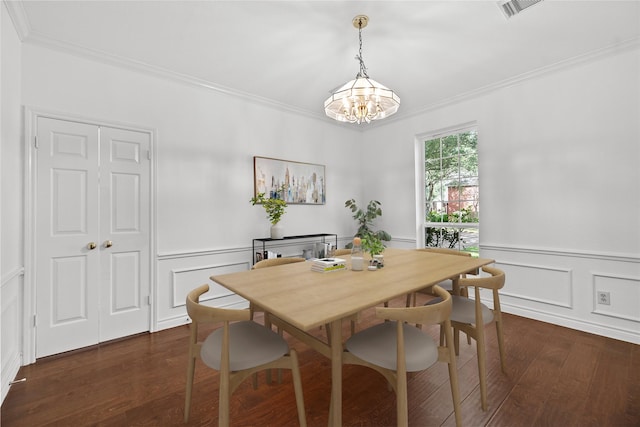 1711 Alcorn Bayou Dr, Sugar Land, TX 77479 - dining room with ornamental molding, dark wood-style flooring, a chandelier, a decorative wall, and wainscoting