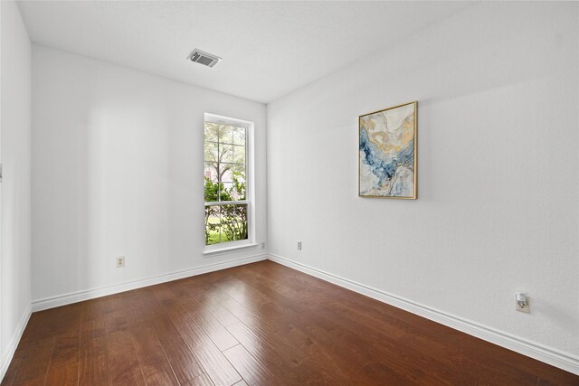 1711 Alcorn Bayou Dr, Sugar Land, TX 77479 - spare room featuring dark wood-style floors and baseboards