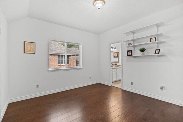 1711 Alcorn Bayou Dr, Sugar Land, TX 77479 - unfurnished room featuring dark wood-style floors and lofted ceiling