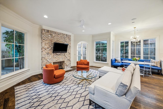 3001 Tangley Rd, West University Place, TX 77005 - living room featuring wood finished floors, a brick fireplace, crown molding, recessed lighting, and a ceiling fan