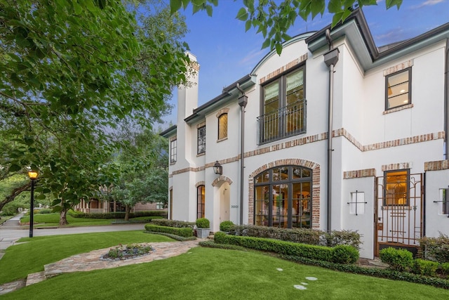 3001 Tangley Rd, West University Place, TX 77005 - mediterranean / spanish-style home featuring a chimney and a front yard