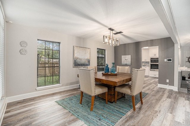 3611 18th St N, Texas City, TX 77590 - dining area with a chandelier and light wood finished floors