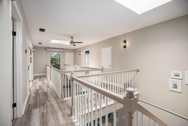3611 18th St N, Texas City, TX 77590 - hallway with a skylight, an upstairs landing, and wood finished floors
