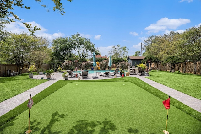 3611 18th St N, Texas City, TX 77590 - view of home's community with a putting green, a pool, a patio area, and a fenced backyard