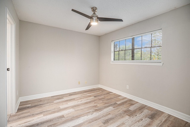 3611 18th St N, Texas City, TX 77590 - unfurnished room featuring light wood-style floors, a ceiling fan, and a textured ceiling