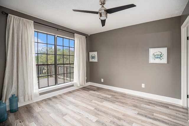 3611 18th St N, Texas City, TX 77590 - spare room with light wood-style floors, ceiling fan, and a textured ceiling