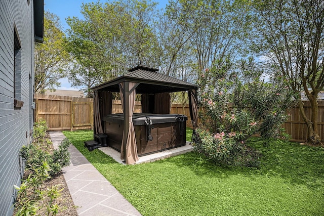 3611 18th St N, Texas City, TX 77590 - view of outdoor structure featuring a hot tub, a gazebo, and a fenced backyard