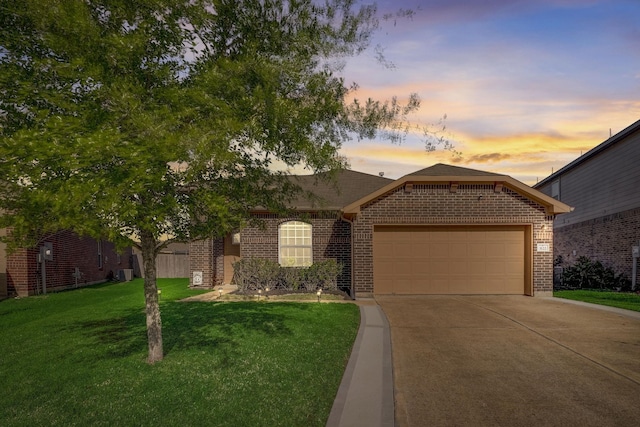 3122 Lodgemist Ln, Dickinson, TX 77539 - view of front of house featuring brick siding, driveway, a garage, and a lawn