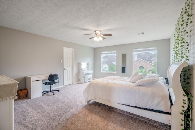 3602 Buchanan Hill Ln, Katy, TX 77494 - bedroom with carpet flooring, a textured ceiling, ceiling fan, and a desk