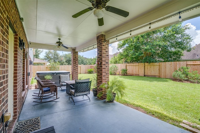 3602 Buchanan Hill Ln, Katy, TX 77494 - fenced backyard with a hot tub, ceiling fan, and a patio