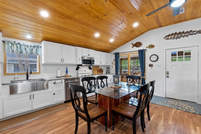 236 Fern, Livingston, TX 77351 - dining room featuring light wood finished floors, wooden ceiling, lofted ceiling, ceiling fan, and recessed lighting