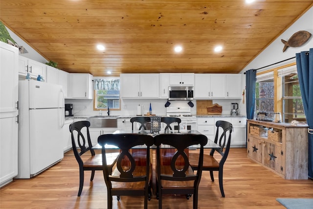 236 Fern, Livingston, TX 77351 - kitchen featuring white appliances, wooden ceiling, lofted ceiling, light wood-type flooring, and white cabinets