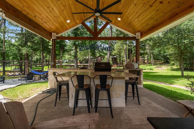 236 Fern, Livingston, TX 77351 - view of patio featuring an outdoor bar, view of scattered trees, a ceiling fan, a gazebo, and area for grilling