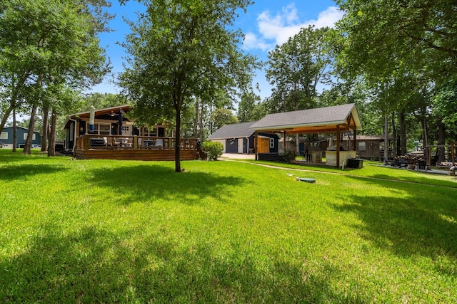 236 Fern, Livingston, TX 77351 - view of green lawn with a wooden deck