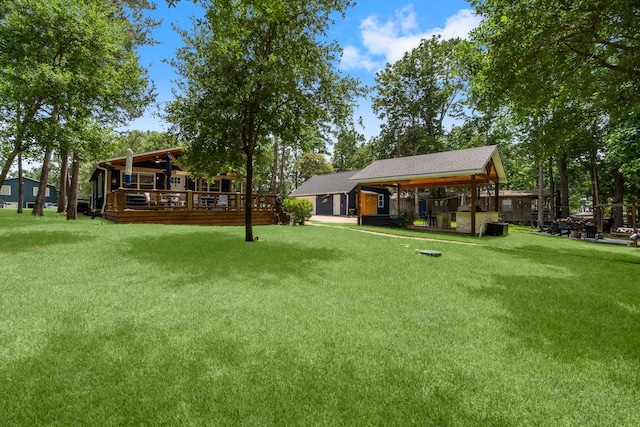 236 Fern, Livingston, TX 77351 - view of green lawn featuring a deck