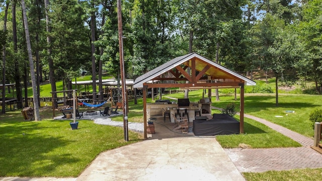 236 Fern, Livingston, TX 77351 - view of home's community with a gazebo, a yard, and view of scattered trees