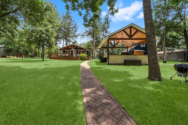 236 Fern, Livingston, TX 77351 - view of grassy yard featuring a wooden deck and a gazebo