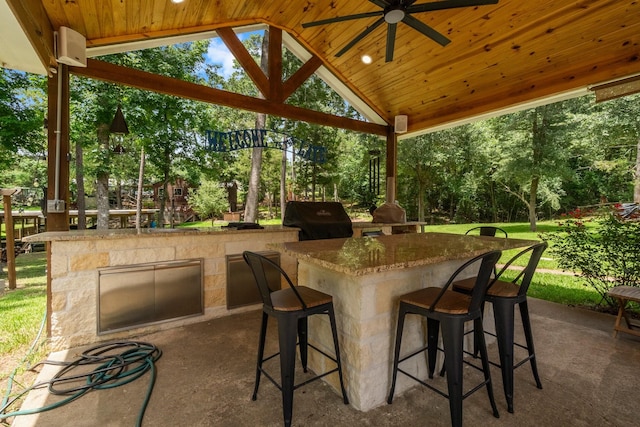236 Fern, Livingston, TX 77351 - view of patio with area for grilling, ceiling fan, view of wooded area, and a gazebo