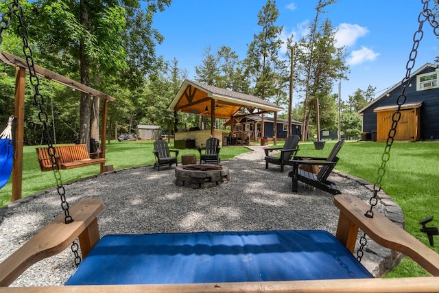 236 Fern, Livingston, TX 77351 - view of patio / terrace with an outdoor fire pit