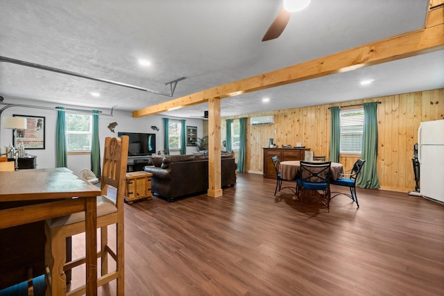 236 Fern, Livingston, TX 77351 - dining space featuring a wall mounted AC, wood finished floors, ceiling fan, healthy amount of natural light, and recessed lighting
