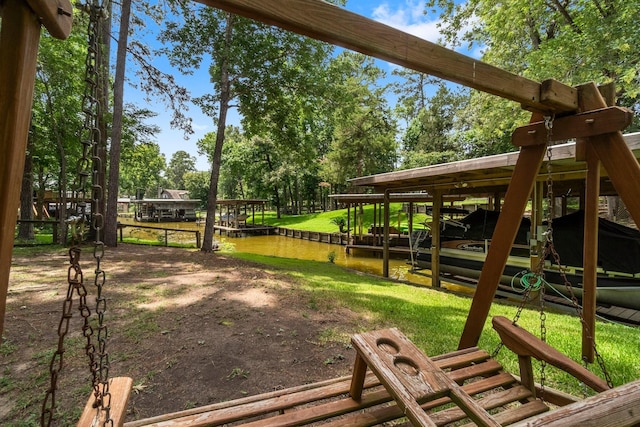 236 Fern, Livingston, TX 77351 - view of home's community featuring boat lift and a boat dock